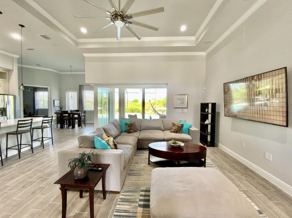 4644 Capri Lane Melbourne, FL 32935 - Photo 5 of 43 a living room with furniture and a flat screen tv