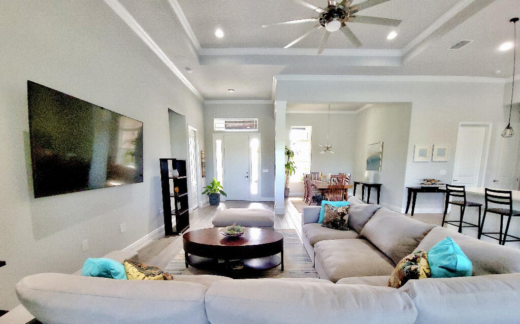 4644 Capri Lane Melbourne, FL 32935 - Photo 6 of 43 a living room with furniture and a flat screen tv
