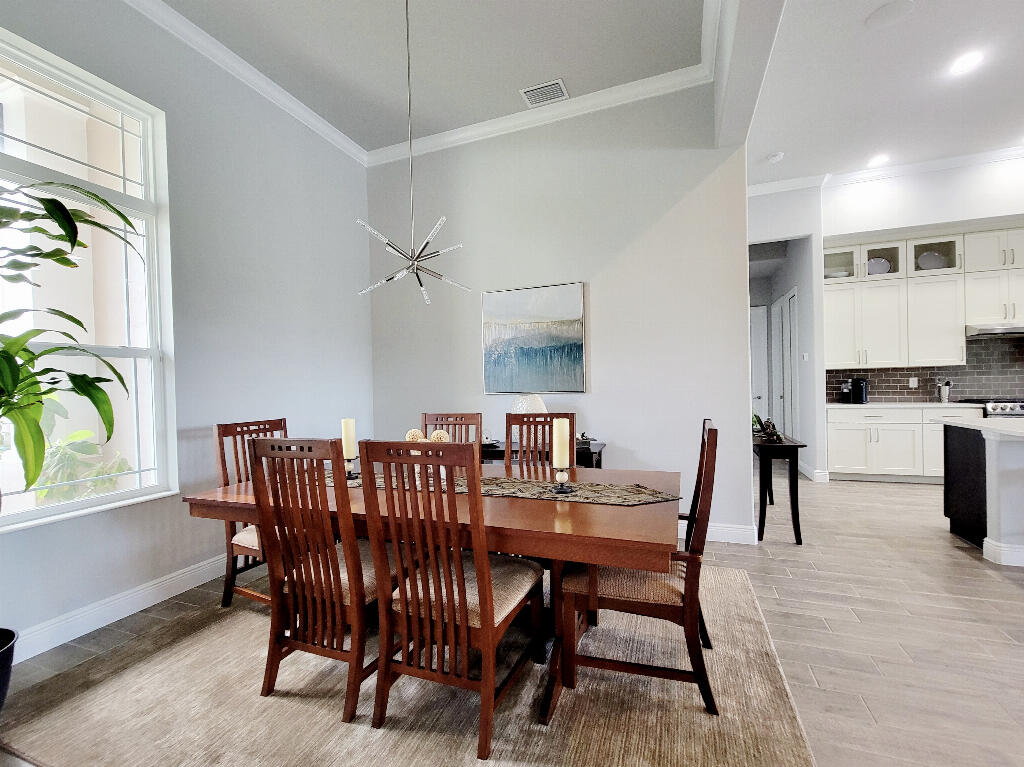 4644 Capri Lane Melbourne, FL 32935 - Photo 7 of 43 a view of a dining room with furniture