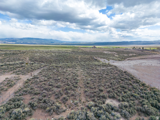 1400 East Highline Road, Unit 1 Loa, UT 84747 - Photo 13 of 17 Aerial view of sparsely populated area with a mountain backdrop