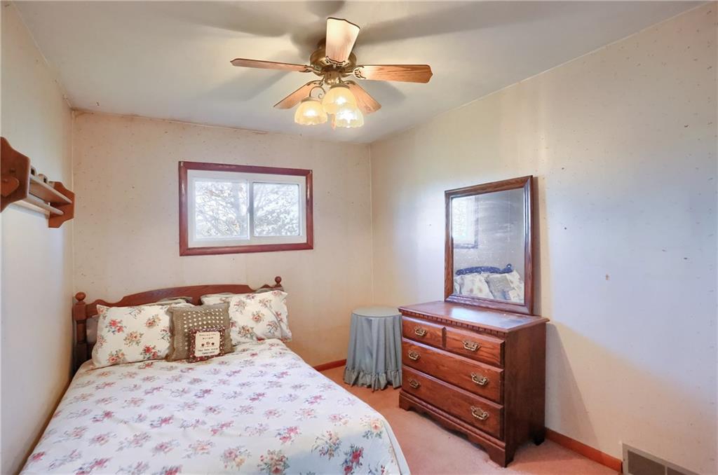 335 McCaslin Road New Castle, PA 16101 - Photo 20 of 31 a bedroom with a bed and a chandelier