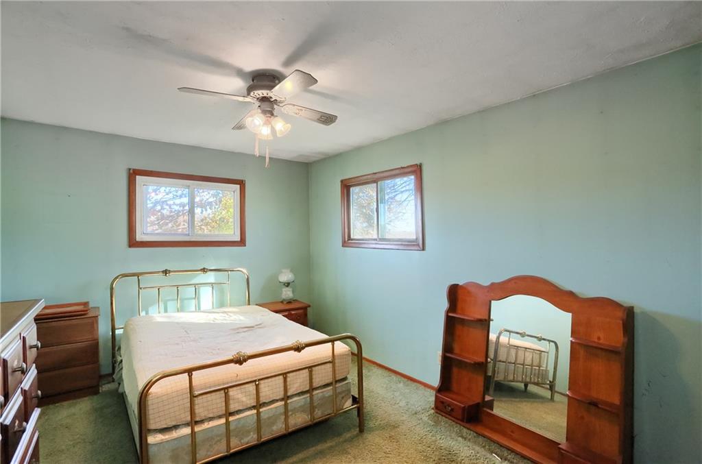 335 McCaslin Road New Castle, PA 16101 - Photo 21 of 31 a bedroom with a bed and a chandelier
