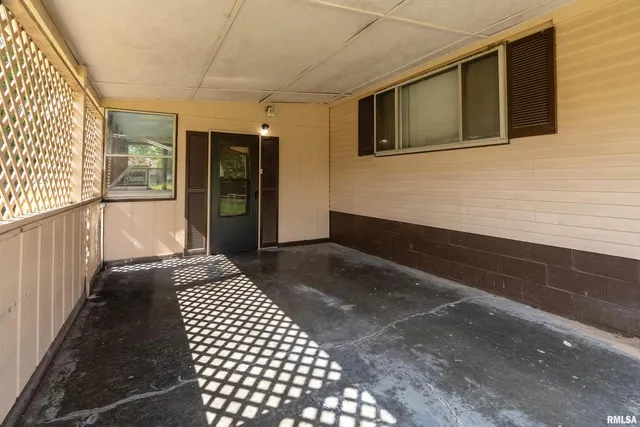a view of a balcony with wooden floor