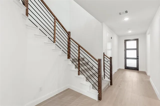 an entryway in a hall with a window