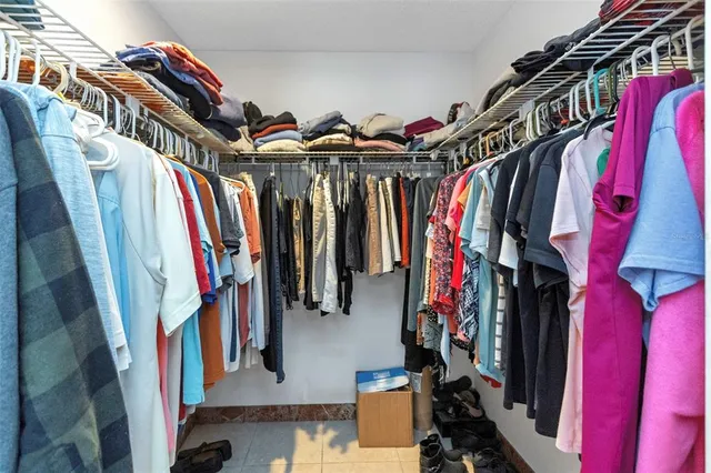 a kitchen with stainless steel appliances a refrigerator and a stove top oven