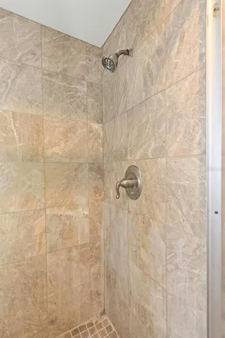 a kitchen with granite countertop a refrigerator stove and microwave