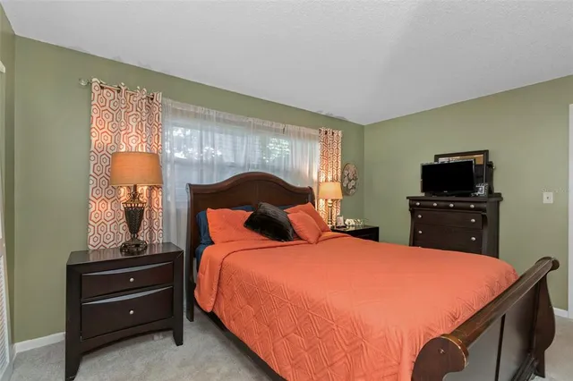 an aerial view of a houses with a yard