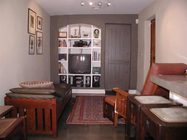 116 West Coronado Road Phoenix, AZ 85003 - Photo 4 of 6 a living room with furniture and a flat screen tv
