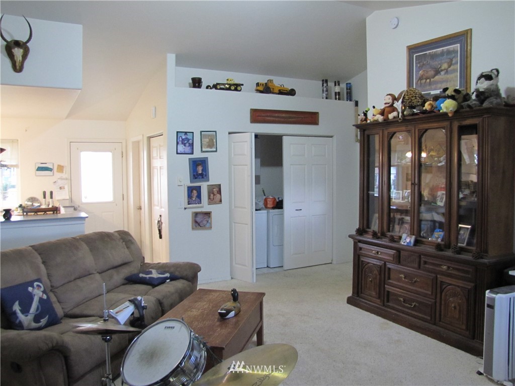 11 Stone Road Sequim, WA 98382 - Photo 12 of 21 a living room with furniture and wooden floor