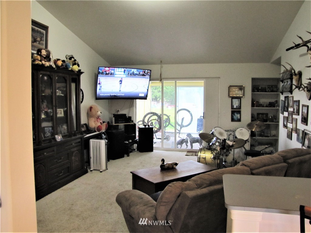 11 Stone Road Sequim, WA 98382 - Photo 13 of 21 a living room with furniture a rug and a window