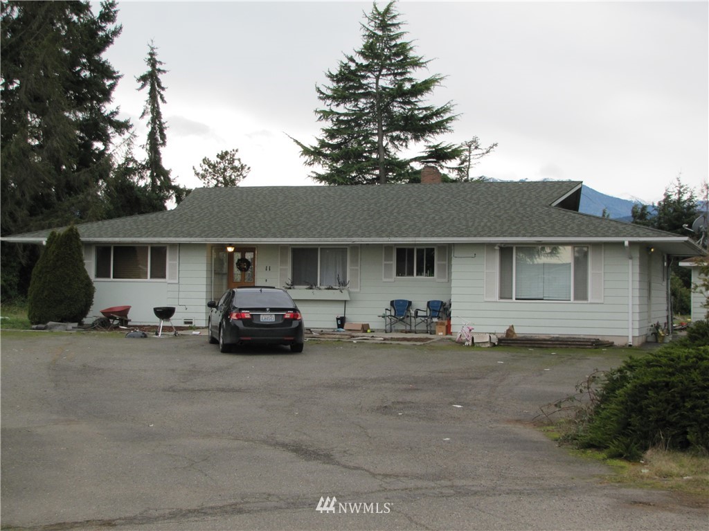 11 Stone Road Sequim, WA 98382 - Photo 3 of 21 front view of a house with car parked