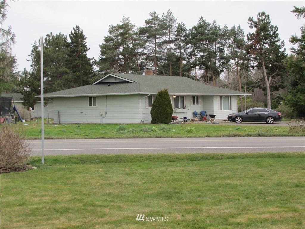 11 Stone Road Sequim, WA 98382 - Photo 4 of 21 a front view of a house with a garden