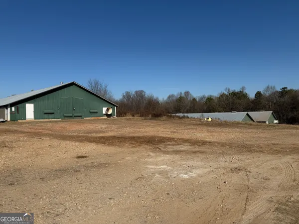 a view of swimming pool with green space