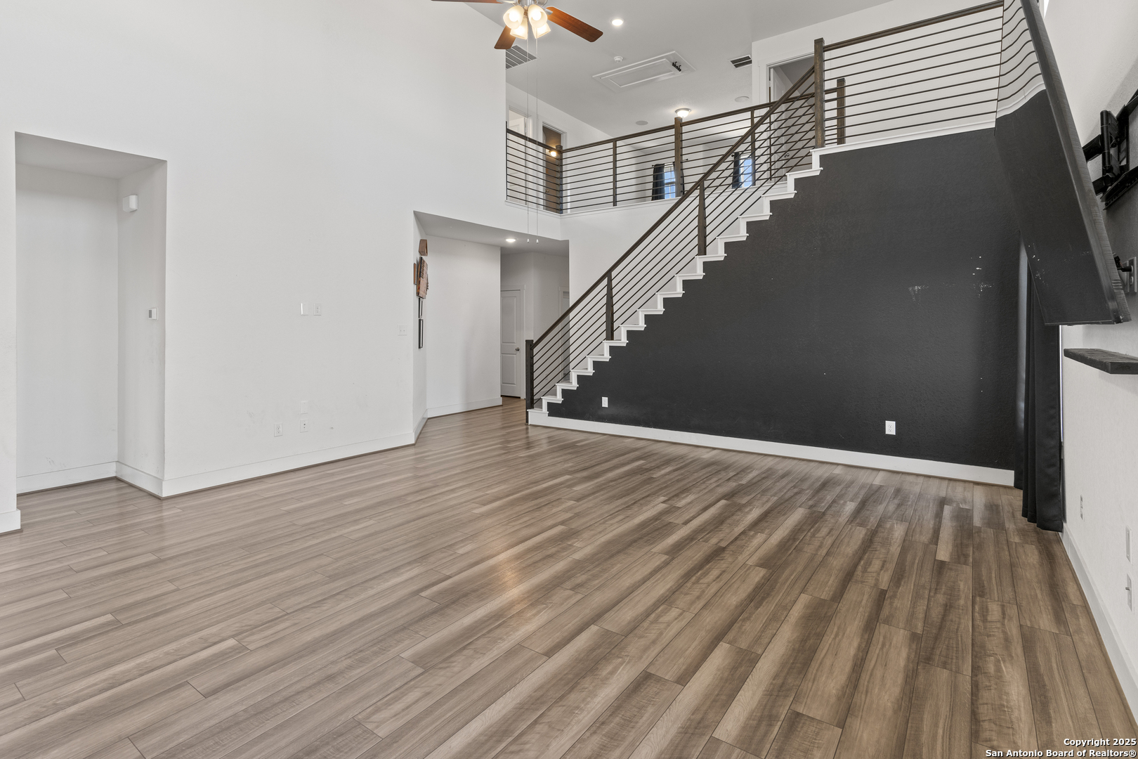 8823 Catnip Pass Elmendorf, TX 78112 - Photo 15 of 34 a view of entryway and hall with wooden floor
