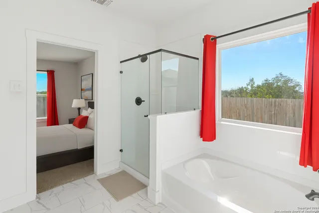 a en suite bathroom with a sink and a mirror