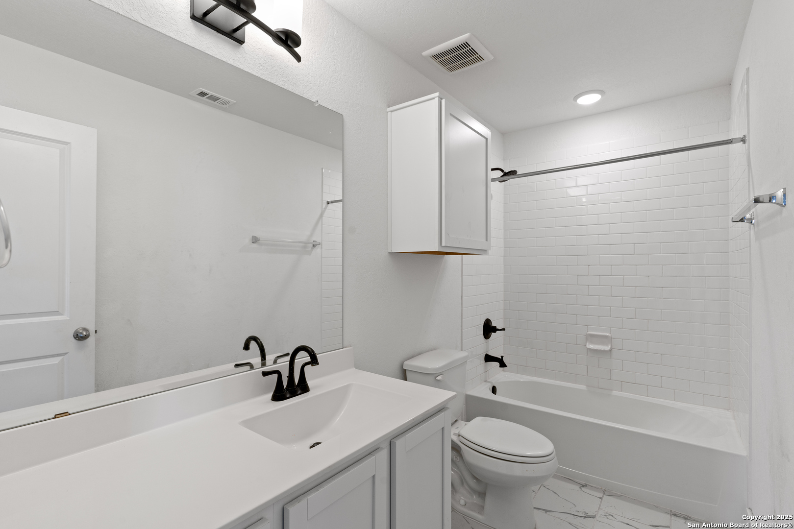 8823 Catnip Pass Elmendorf, TX 78112 - Photo 29 of 34 a bathroom with a sink toilet and shower