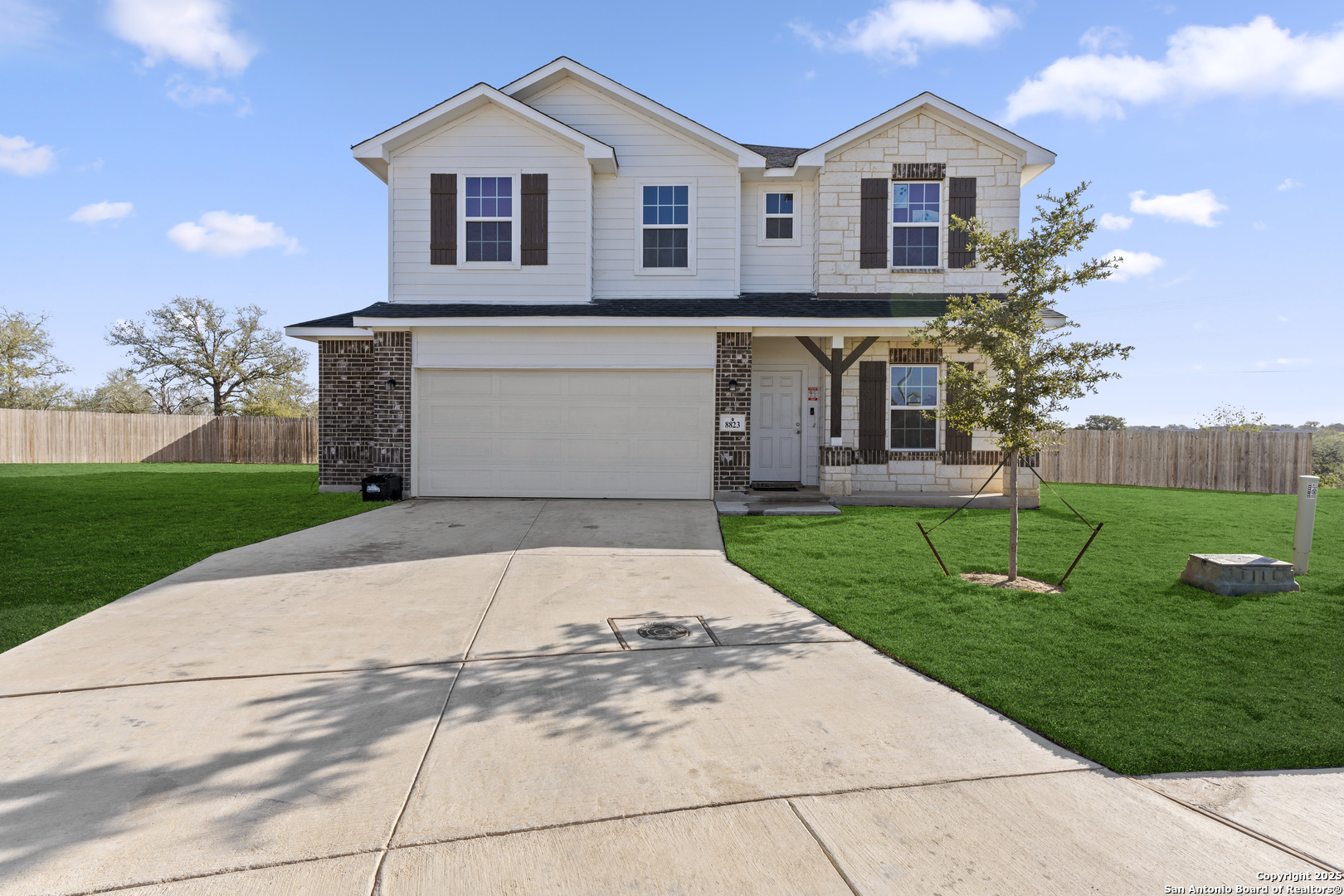 8823 Catnip Pass Elmendorf, TX 78112 - Photo 3 of 34 a front view of house with yard and green space