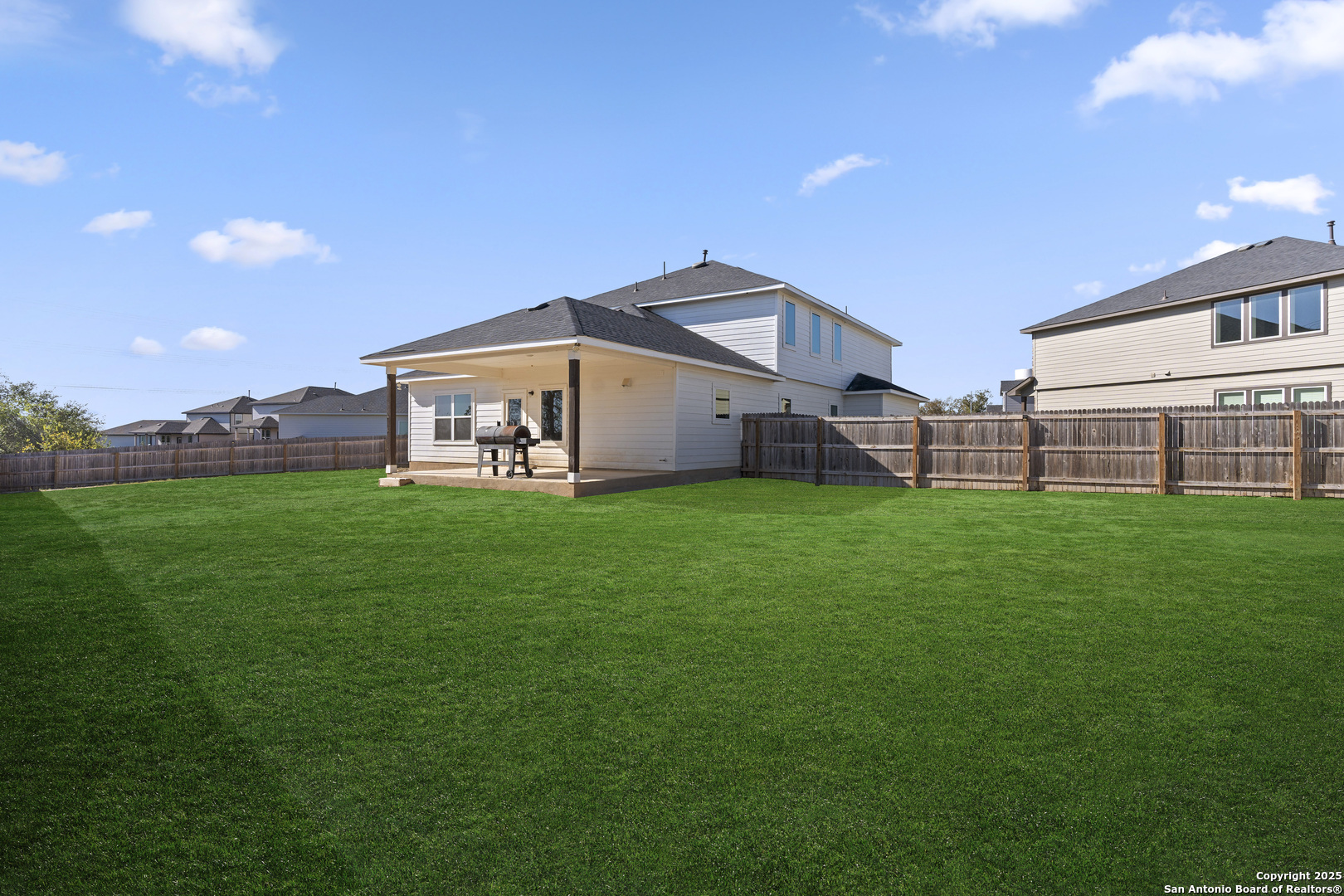 8823 Catnip Pass Elmendorf, TX 78112 - Photo 6 of 34 a front view of a house with garden