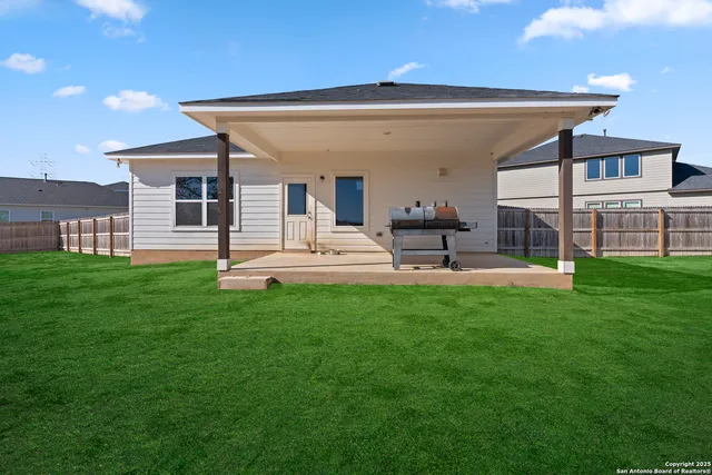 a view of a back yard of the house