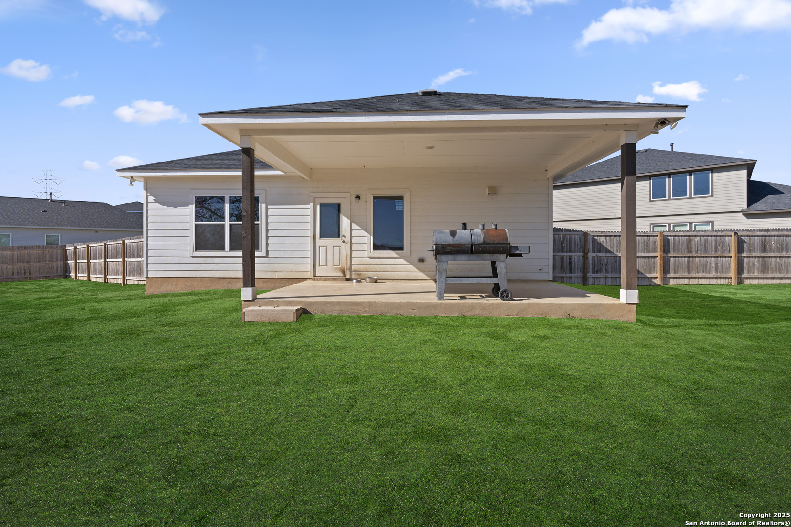 8823 Catnip Pass Elmendorf, TX 78112 - Photo 7 of 34 a view of a house with a backyard