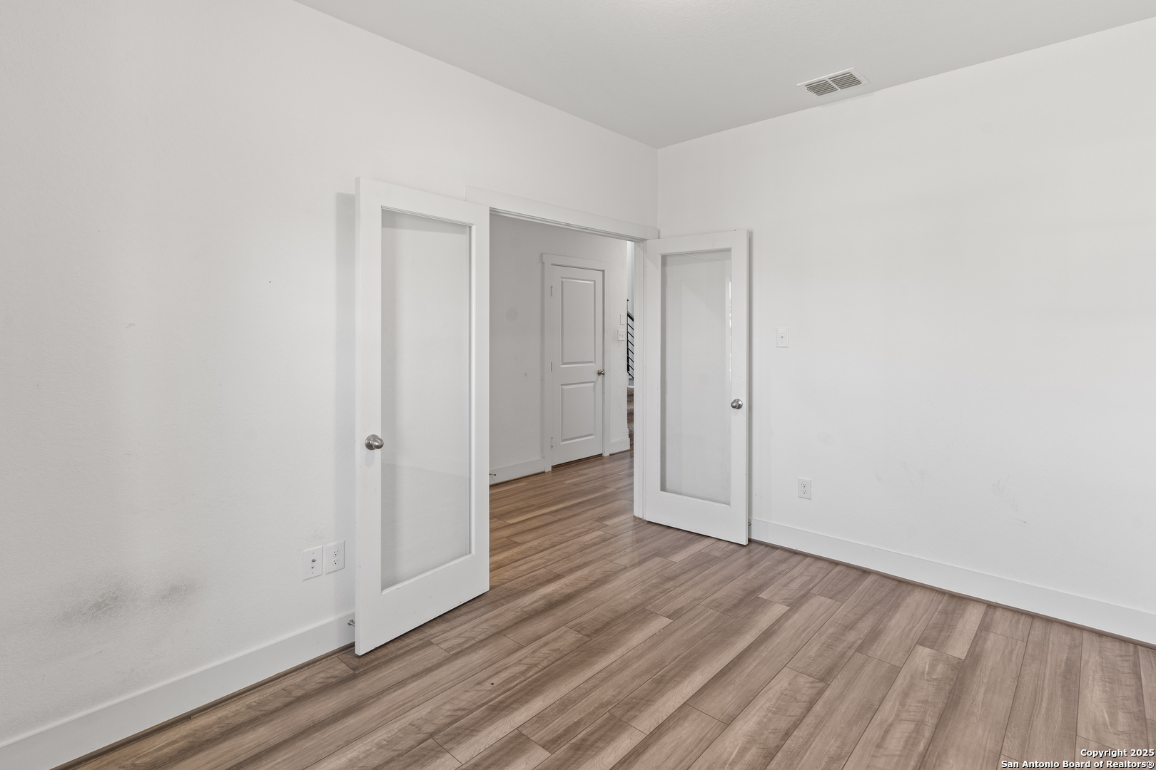 8823 Catnip Pass Elmendorf, TX 78112 - Photo 10 of 34 a view of hallway with wooden floor