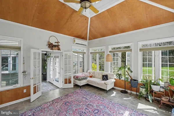 a bedroom with furniture and wooden floor