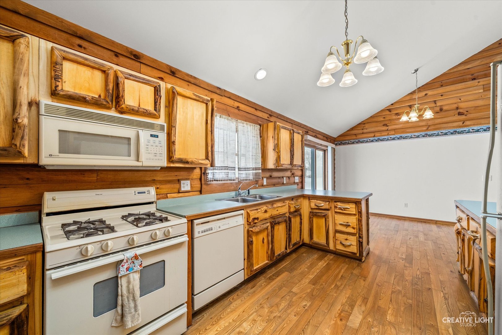122 Belle Rive Drive Millington, IL 60537 - Photo 15 of 31 a kitchen with stainless steel appliances granite countertop a stove cabinets and wooden floor