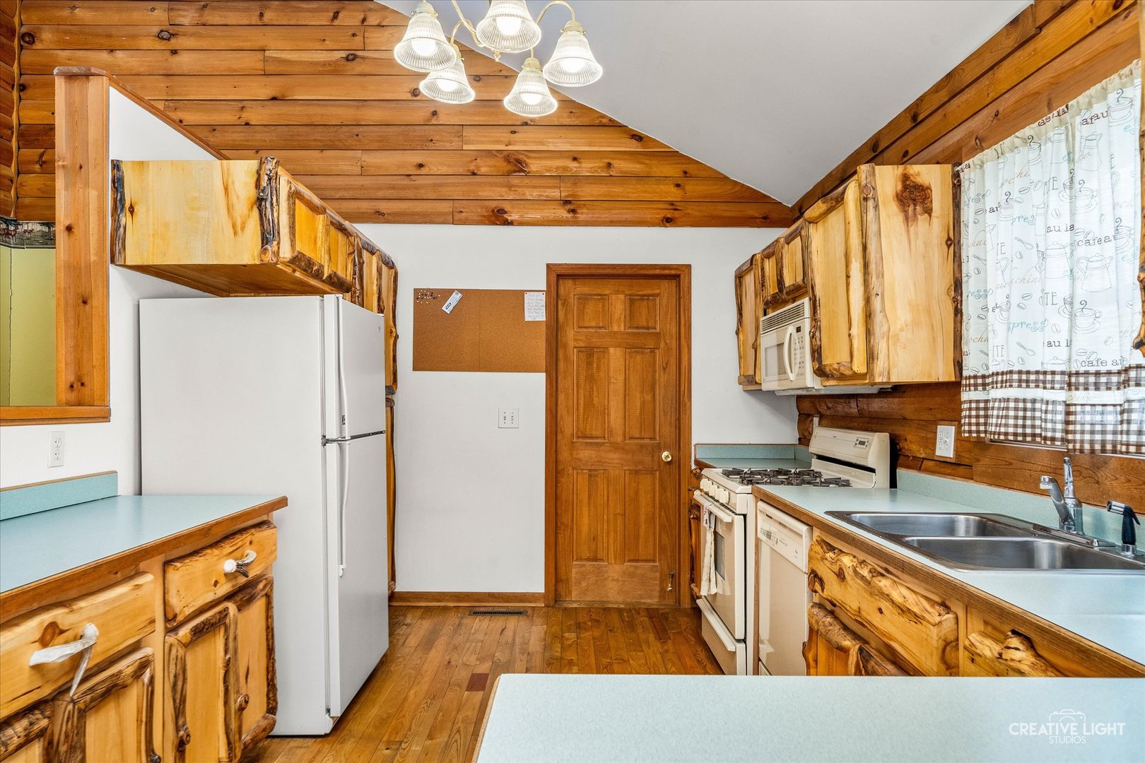 122 Belle Rive Drive Millington, IL 60537 - Photo 16 of 31 a kitchen with stainless steel appliances granite countertop a sink a refrigerator and a stove