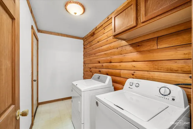 a bedroom with a bed a couch and dresser