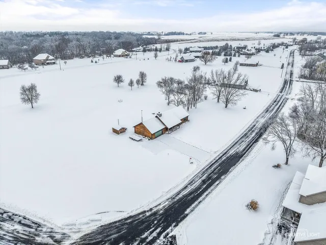 a view of a covered with snow on the road