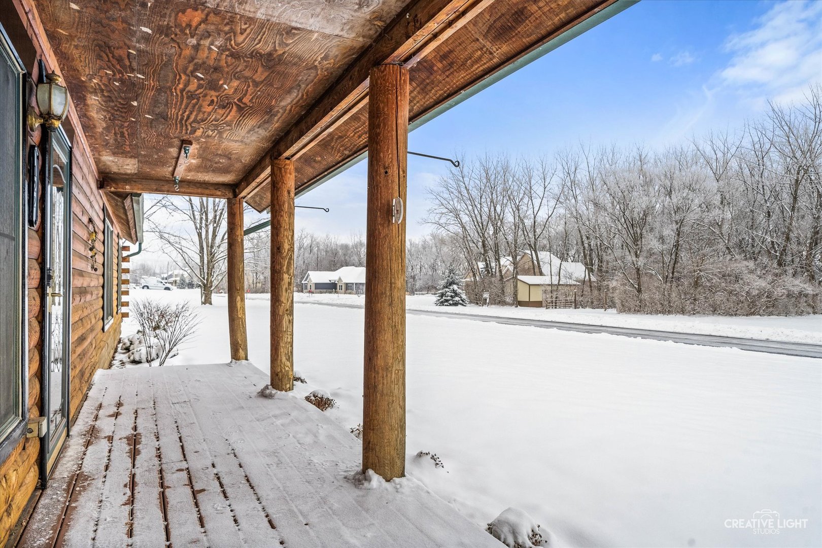 122 Belle Rive Drive Millington, IL 60537 - Photo 6 of 31 a view of backyard with large trees and wooden fence