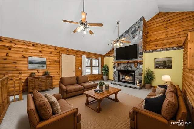 a view of an empty room with a fireplace