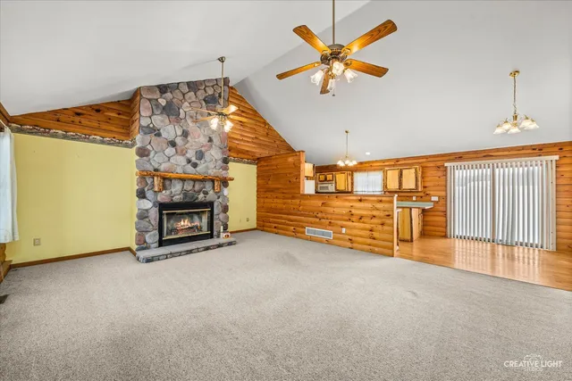 wooden floor with a chandelier