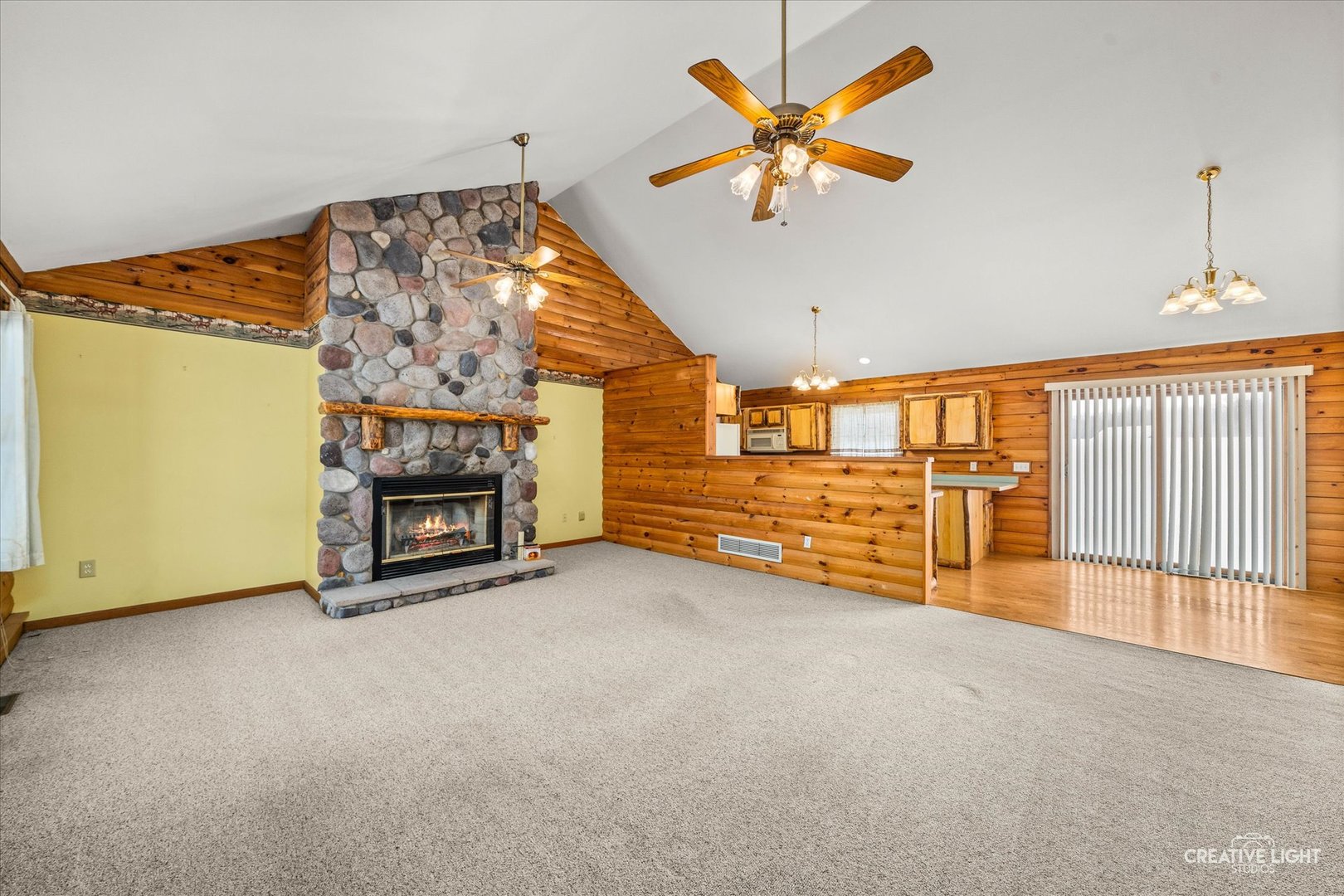 122 Belle Rive Drive Millington, IL 60537 - Photo 9 of 31 an empty room with windows and fireplace