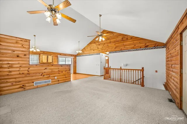 a dining room with furniture window and wooden floor