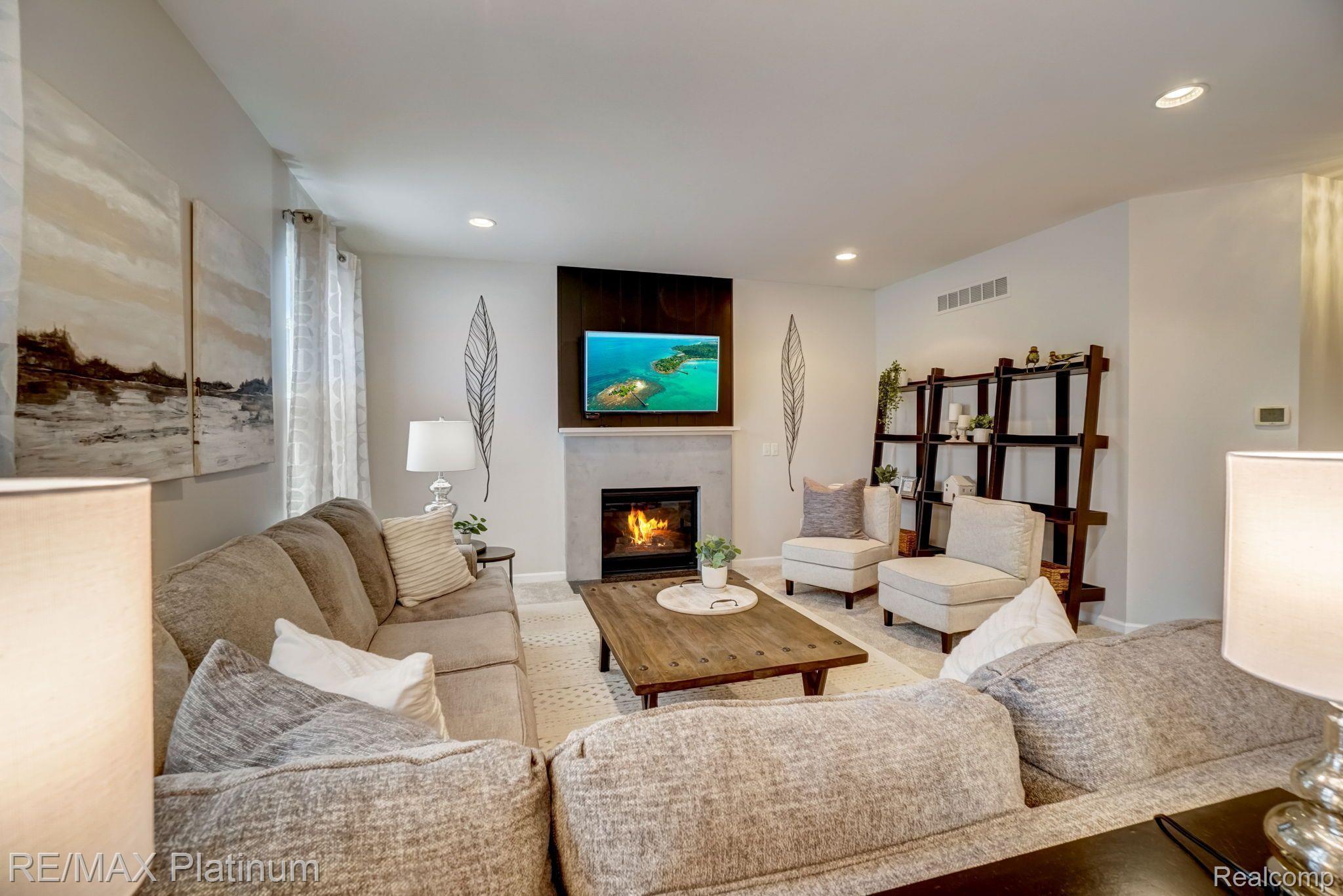1200 Risen Star Way Howell, MI 48843 - Photo 6 of 27 Gas Fireplace and New Carpeting
