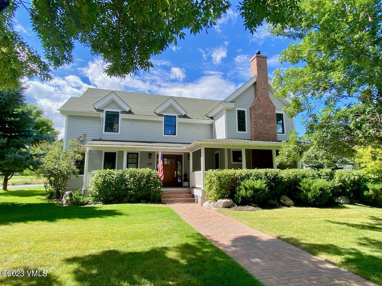275 Robins Egg Eagle, CO 81631 - Photo 2 of 46 a front view of house with yard and green space