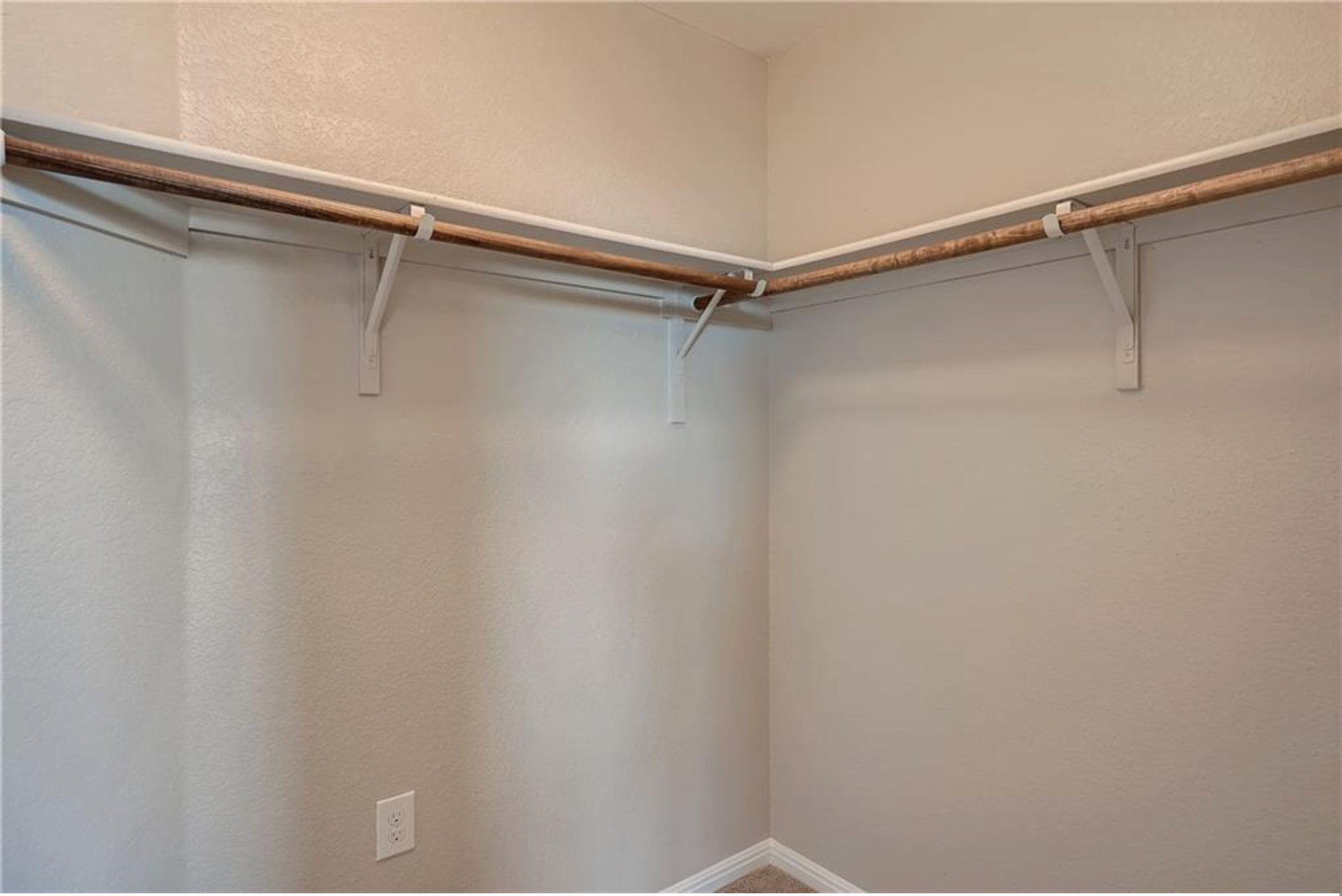 304 Cane River Road Pflugerville, TX 78660 - Photo 21 of 31 Ample hanging space and shelving offer smart organization within this closet.
