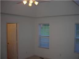 Master bedroom located on first floor offers privacy, a large master bath, walk-in closet, and trey ceilings.