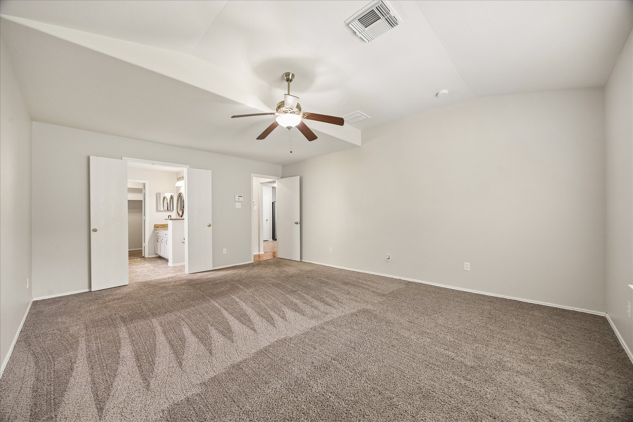 223 Sunset Colony Drive Rosharon, TX 77583 - Photo 18 of 50 This private 1st-floor owner’s suite is complete with a massive walk-in closet and beautiful ensuite bathroom. This space is ready for quiet evenings, relaxed mornings and a little extra breathing room when you need it.