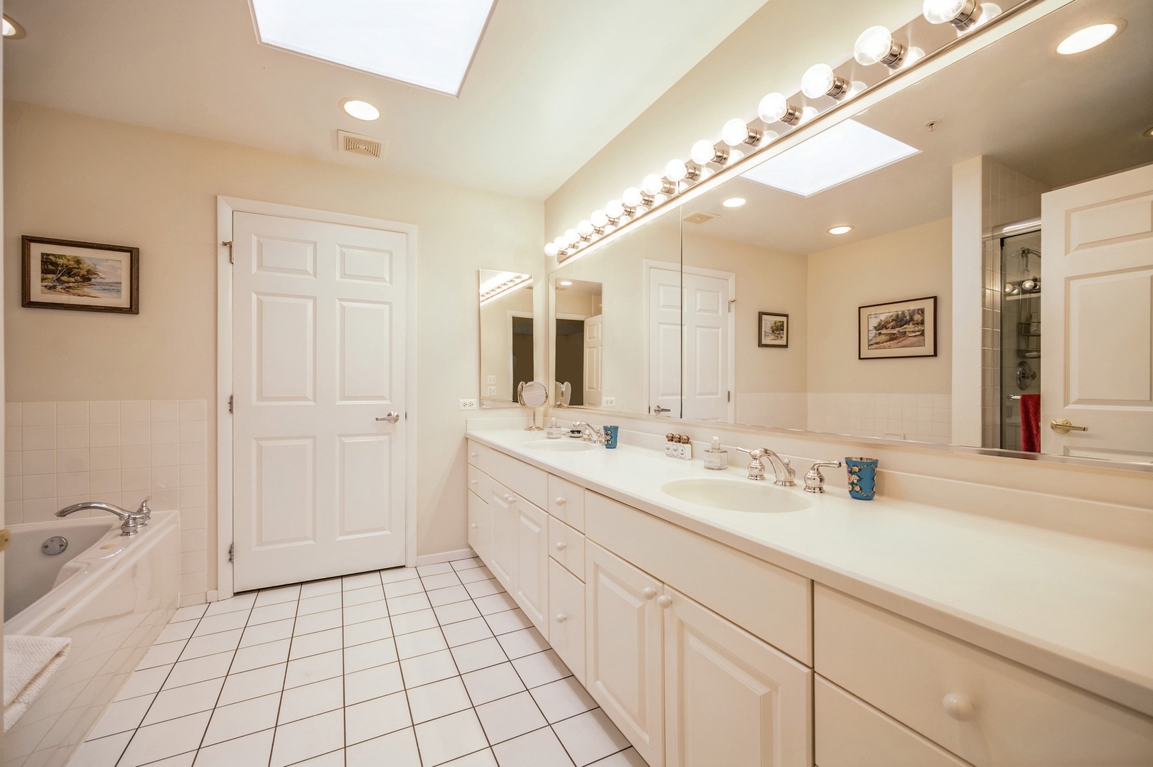 360 Green Bay Road, Unit 4C Winnetka, IL 60093 - Photo 13 of 16 a spacious bathroom with a double vanity sink mirror and
