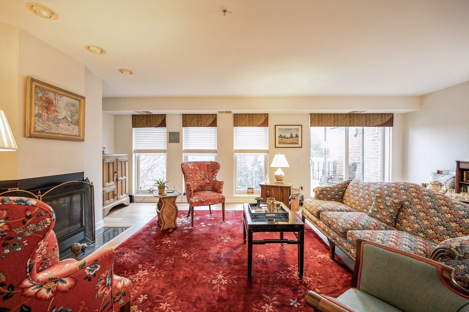 360 Green Bay Road, Unit 4C Winnetka, IL 60093 - Photo 7 of 16 a living room with furniture large window and a fireplace