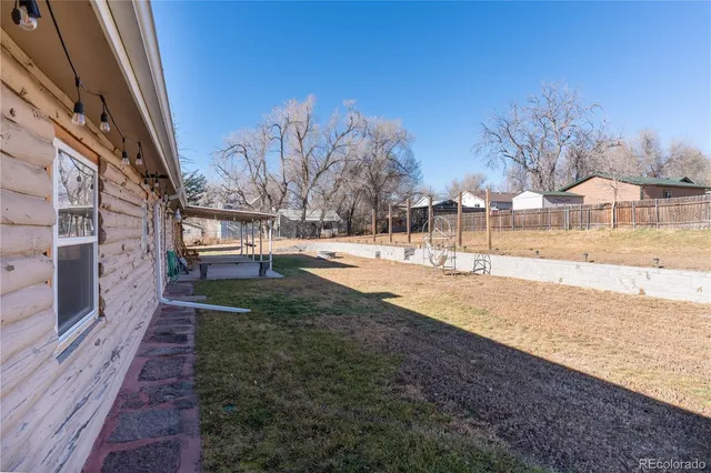 a view of a yard with snow on the road