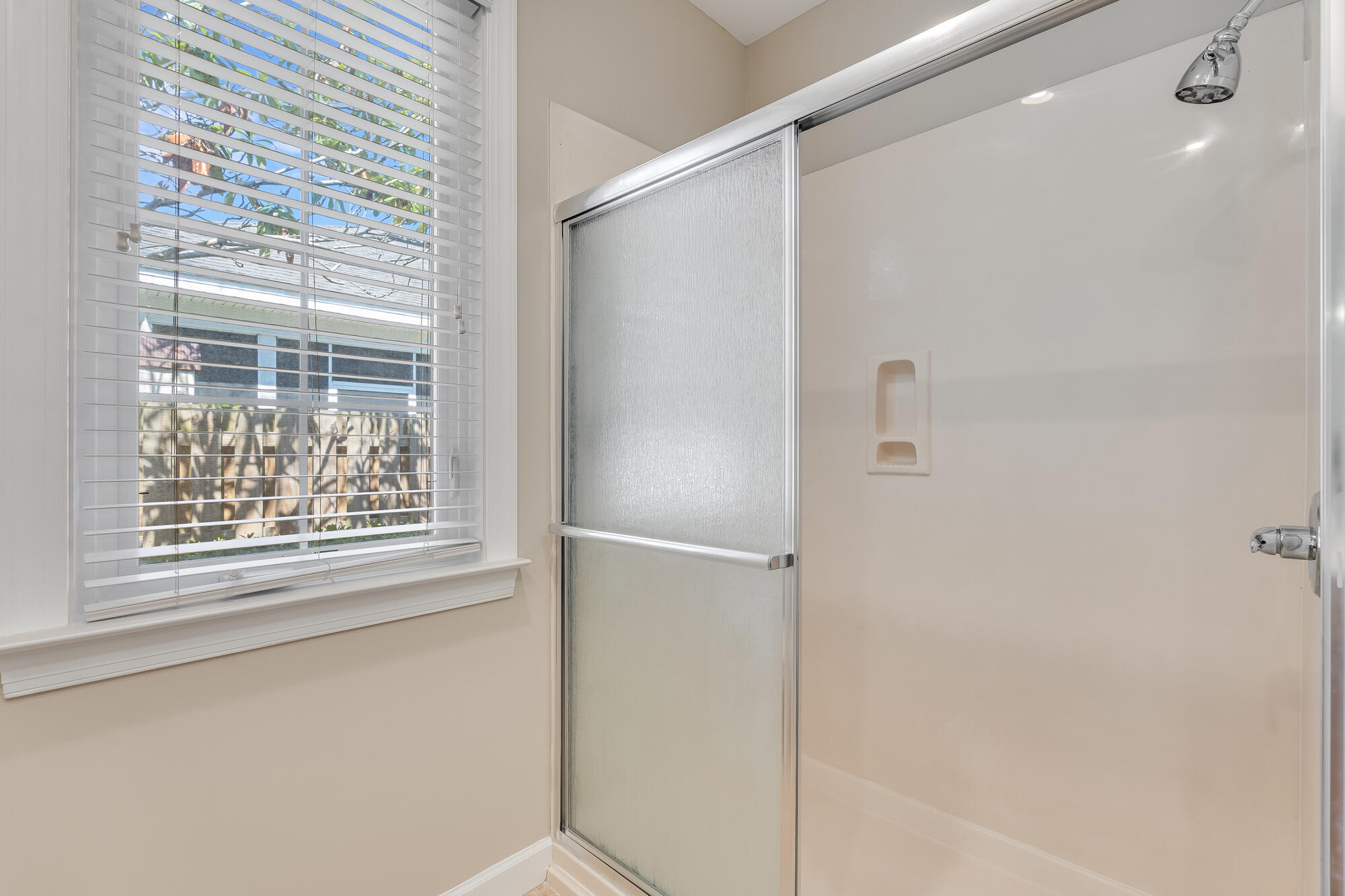 174 South Zander Way Santa Rosa Beach, FL 32459 - Photo 12 of 20 a bathroom with a glass shower door