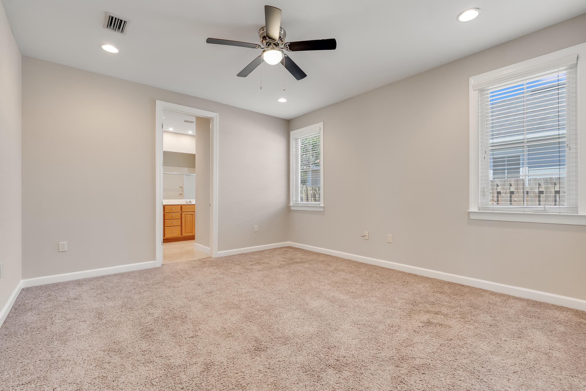174 South Zander Way Santa Rosa Beach, FL 32459 - Photo 10 of 20 an empty room with windows and cabinet