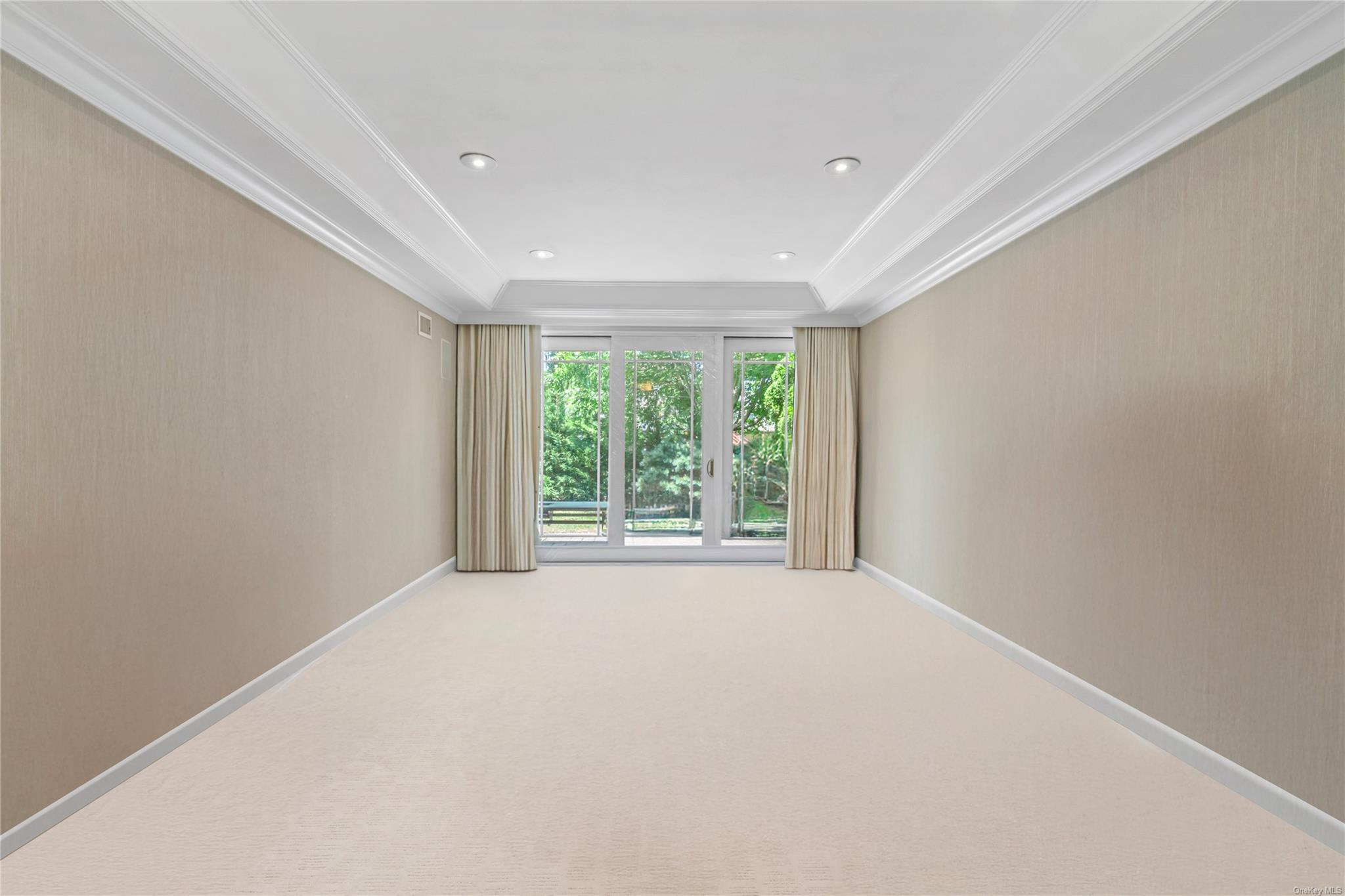 8 Holiday Pond Road Jericho, NY 11753 - Photo 21 of 43 Empty room featuring ornamental molding, carpet, and recessed lighting