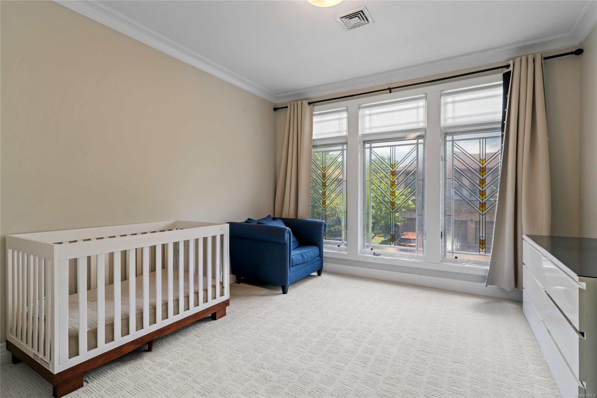 8 Holiday Pond Road Jericho, NY 11753 - Photo 25 of 43 Bedroom with crown molding and light colored carpet