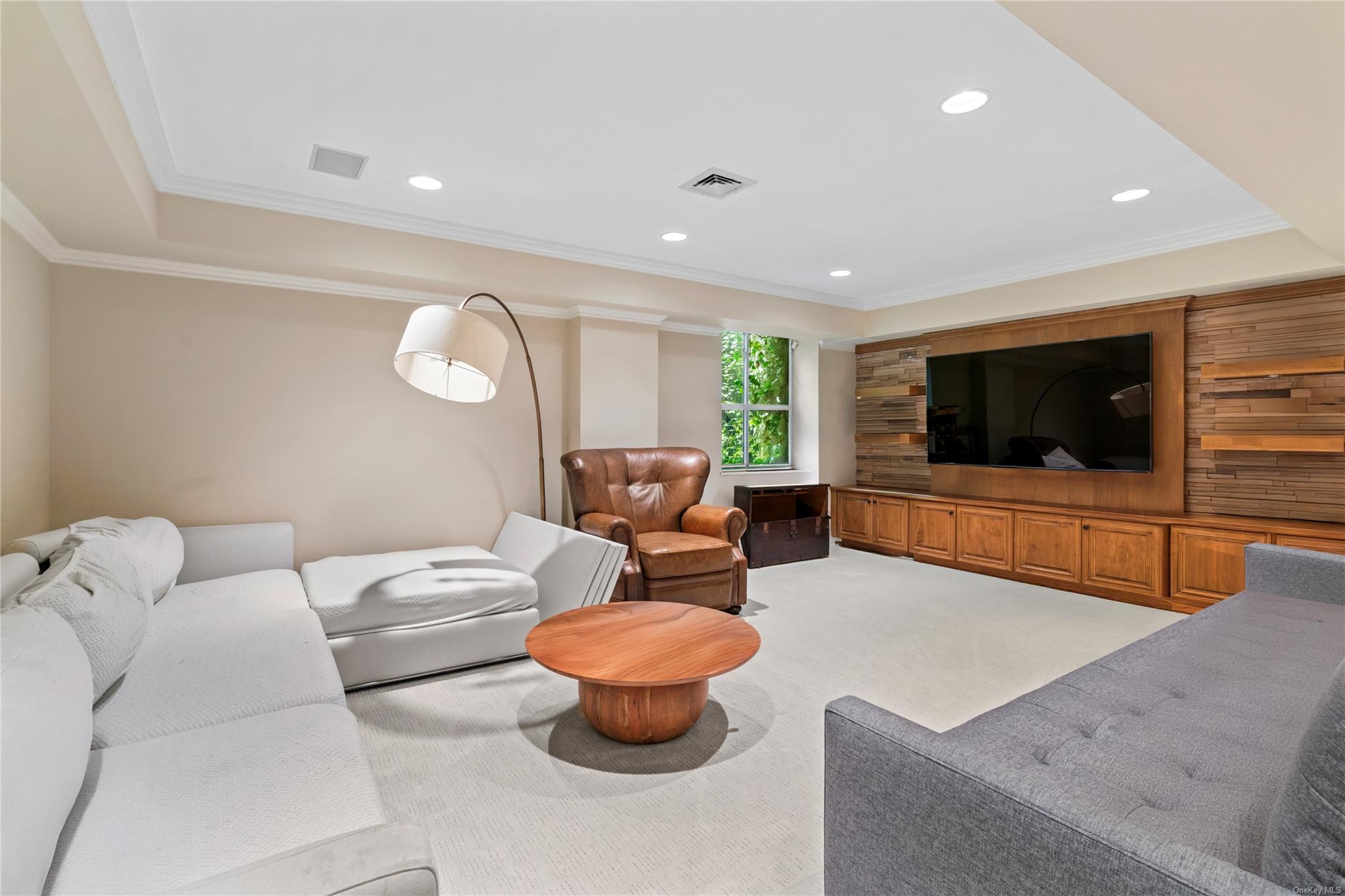 8 Holiday Pond Road Jericho, NY 11753 - Photo 31 of 43 Carpeted living area featuring ornamental molding and recessed lighting