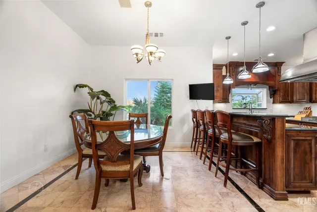 a living room with furniture stove and a refrigerator