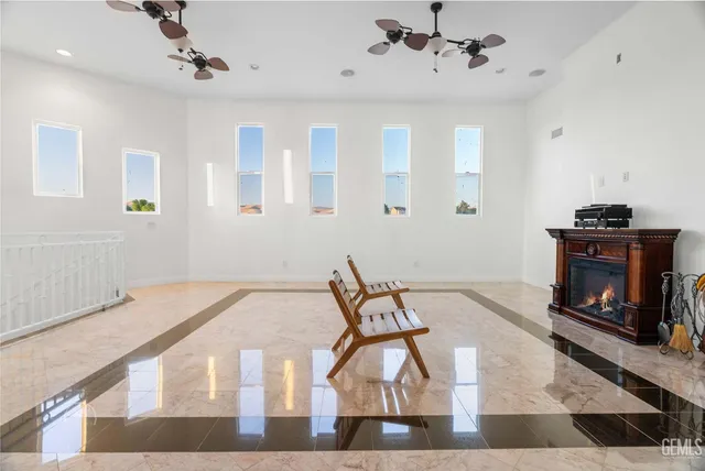 an aerial view of a house with a garden and a yard